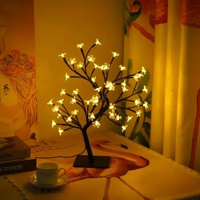 Sakura Flower Lamp illuminating a cozy room with delicate cherry blossom lights and bonsai-style design.