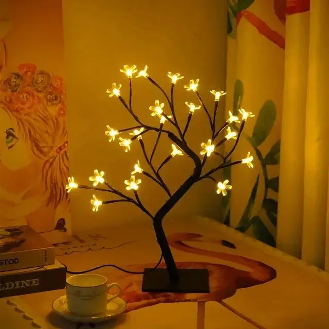 Sakura Flower Lamp illuminating a cozy room with its delicate cherry blossom-inspired design and flexible branches.