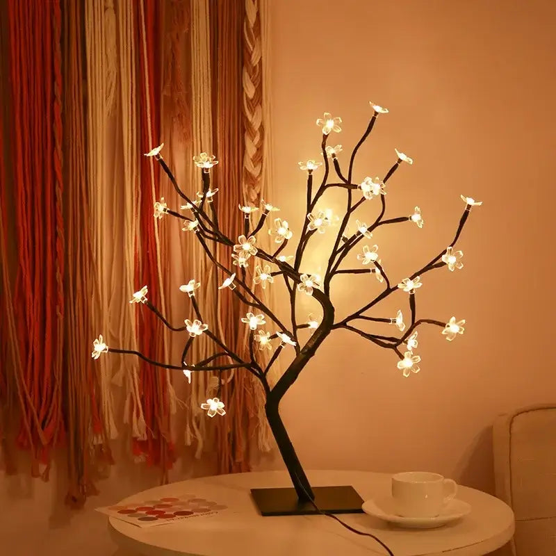 Elegant Sakura Flower Lamp with illuminated cherry blossom design, placed on a table adding a serene ambiance to the room.